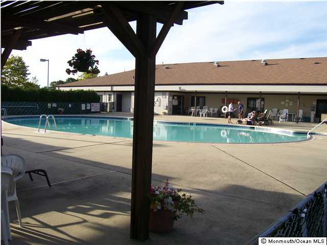 7 Garrett Road Toms River, NJ 08757 - Photo 3 of 3 a view of swimming pool from a balcony