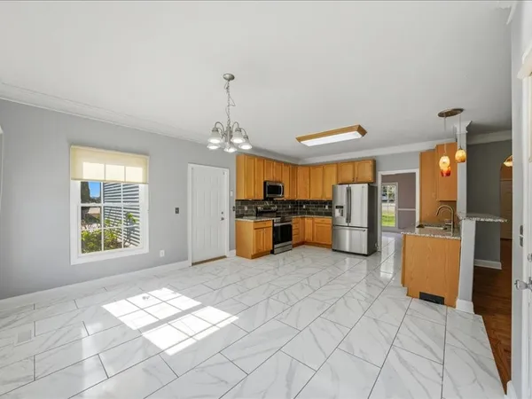 a view of a kitchen with furniture and a window