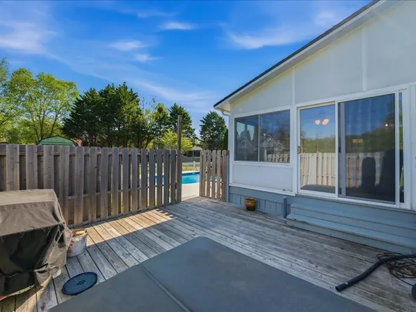 a balcony with wooden floor