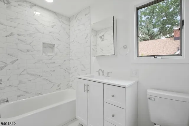 a view of play room with toys and entryway