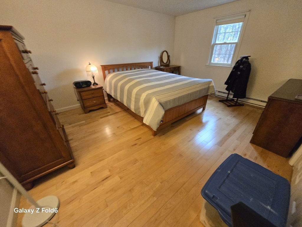 222 Buck Island Road, Unit 45 Yarmouth, MA 02673 - Photo 16 of 26 a bedroom with bed and window