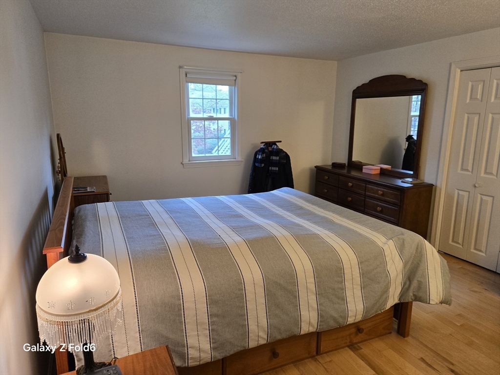 222 Buck Island Road, Unit 45 Yarmouth, MA 02673 - Photo 17 of 26 a bedroom with a bed and window