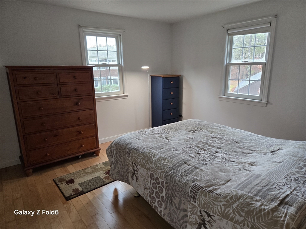 222 Buck Island Road, Unit 45 Yarmouth, MA 02673 - Photo 18 of 26 a bedroom with a bed and a window