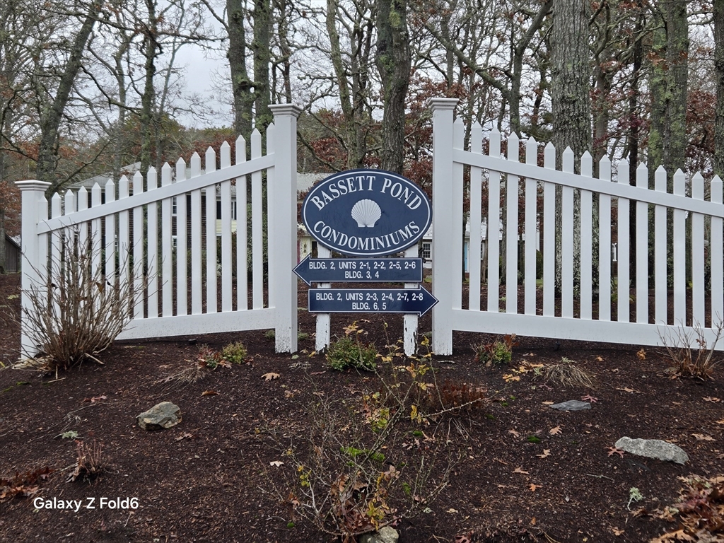 222 Buck Island Road, Unit 45 Yarmouth, MA 02673 - Photo 2 of 26 a view of a bench in backyard of house