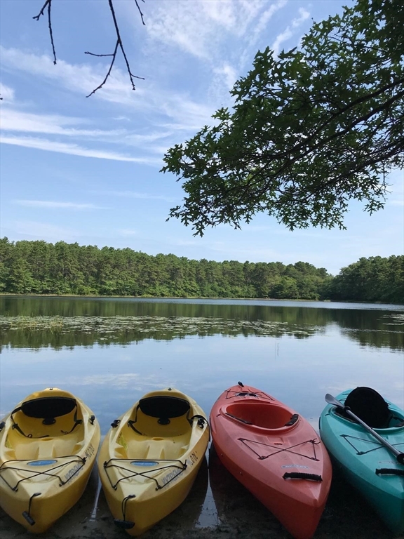 222 Buck Island Road, Unit 45 Yarmouth, MA 02673 - Photo 24 of 26 a view of a lake with a car parked from a lake
