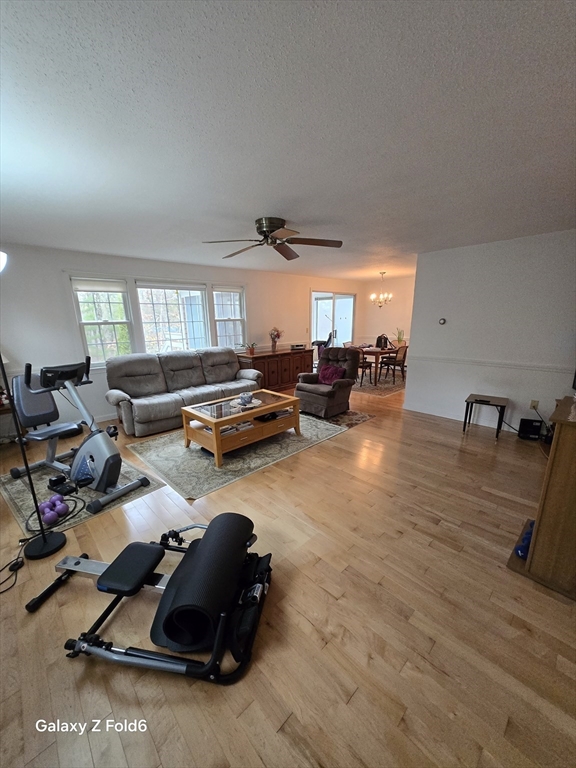 222 Buck Island Road, Unit 45 Yarmouth, MA 02673 - Photo 4 of 26 a room with furniture and a wooden floor