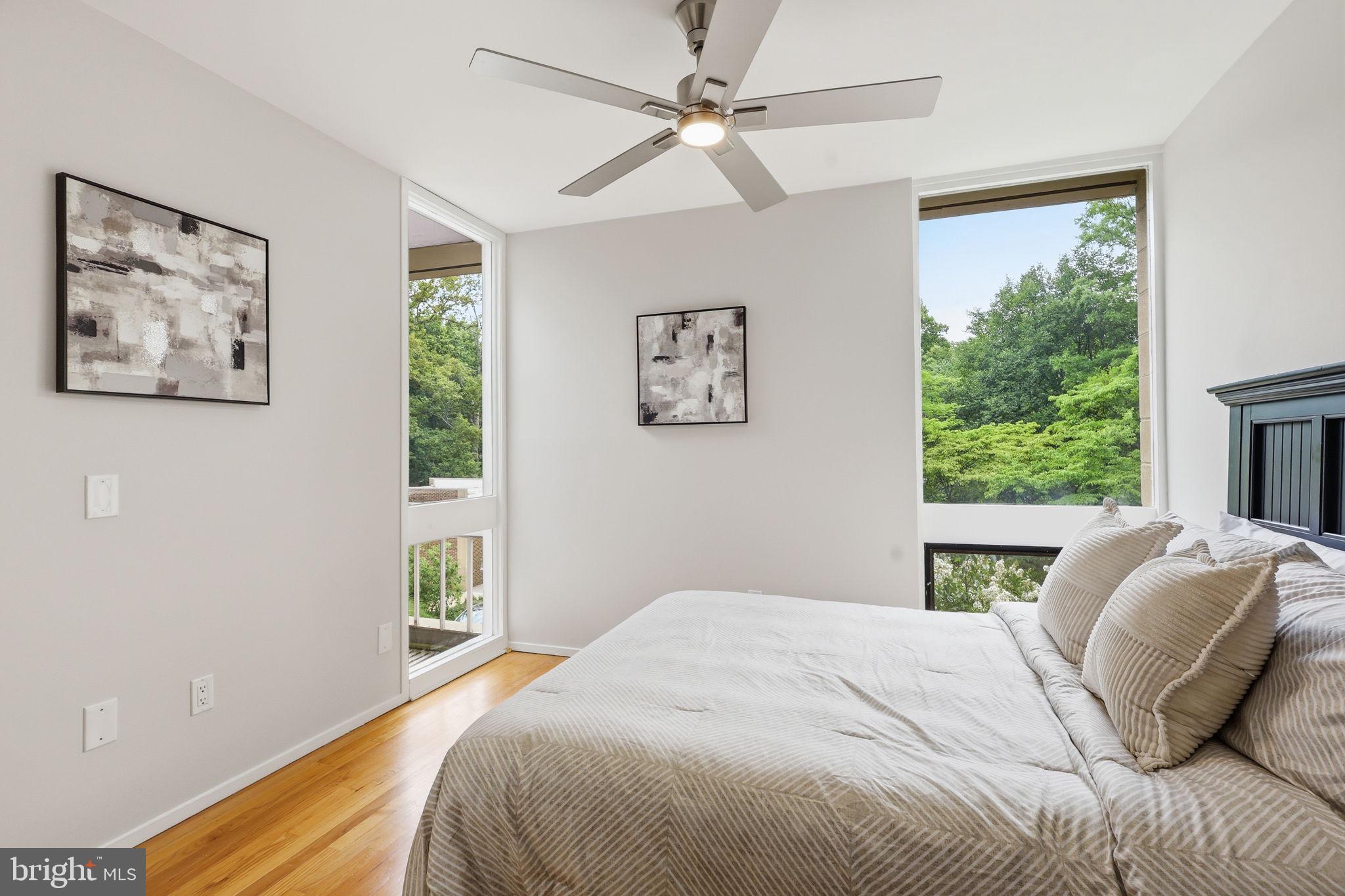 11510 Maple Ridge Road Reston, VA 20190 - Photo 23 of 43 a bedroom with a bed and a window