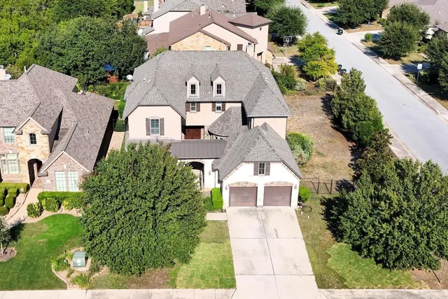 an aerial view of a house with a garden