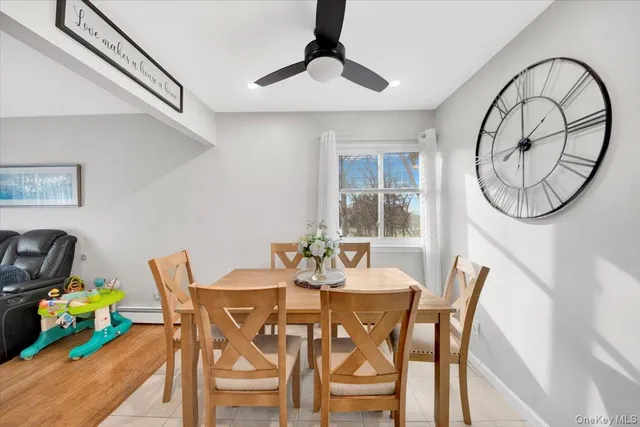a view of a dining room with furniture and a chandelier