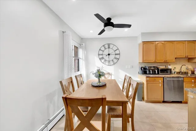 a view of a dining room with furniture and a large window