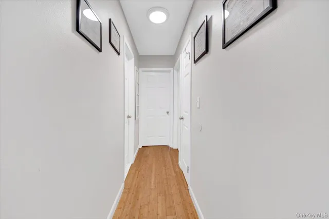 a view of a room with wooden floor and staircase