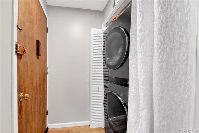 a close view of a utility room with dryer and washer