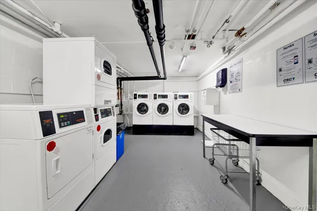 a white building with sink and white cabinets