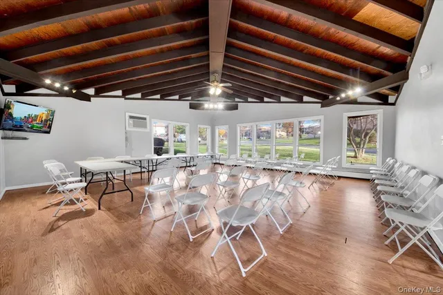 a view of a room with furniture window and wooden floor