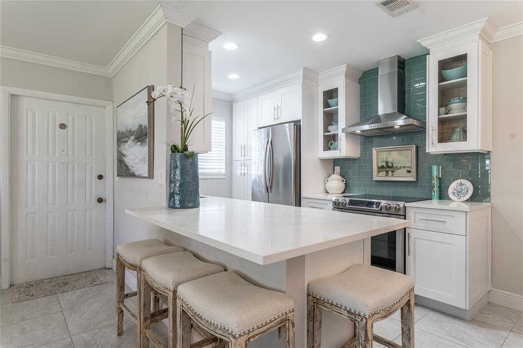 1130 Cir Terrace West, Unit D Delray Beach, FL 33445 - Photo 12 of 39 a large kitchen with a table and chairs