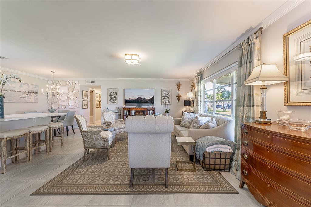 1130 Cir Terrace West, Unit D Delray Beach, FL 33445 - Photo 15 of 39 a living room with furniture a rug and a table