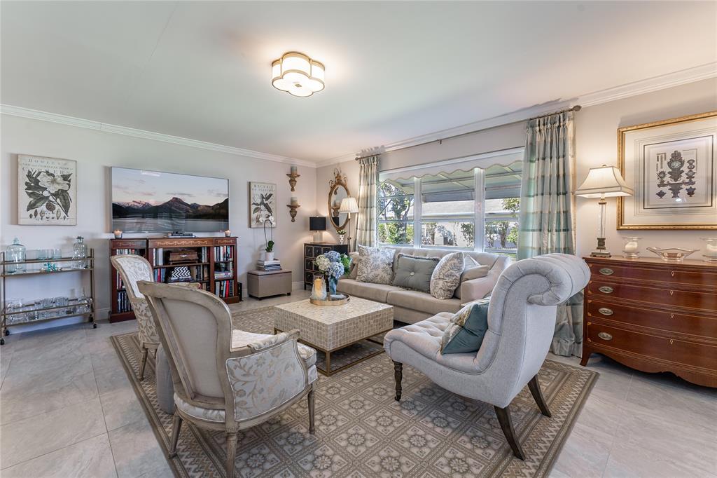 1130 Cir Terrace West, Unit D Delray Beach, FL 33445 - Photo 17 of 39 a living room with furniture and a window