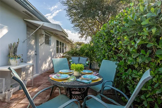 a view of a backyard with furniture