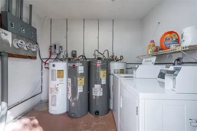 a view of a kitchen with fridge and workspace