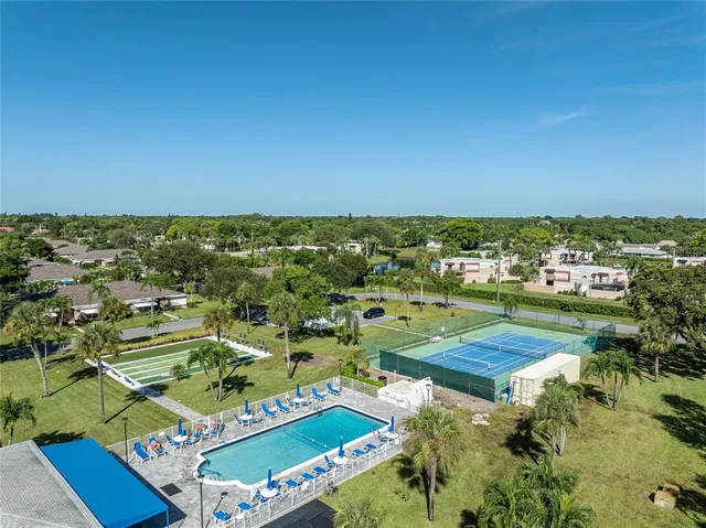 an aerial view of residential houses with outdoor space