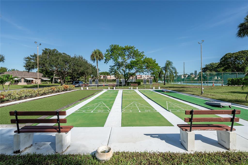 1130 Cir Terrace West, Unit D Delray Beach, FL 33445 - Photo 28 of 39 a view of a park with lounge chairs
