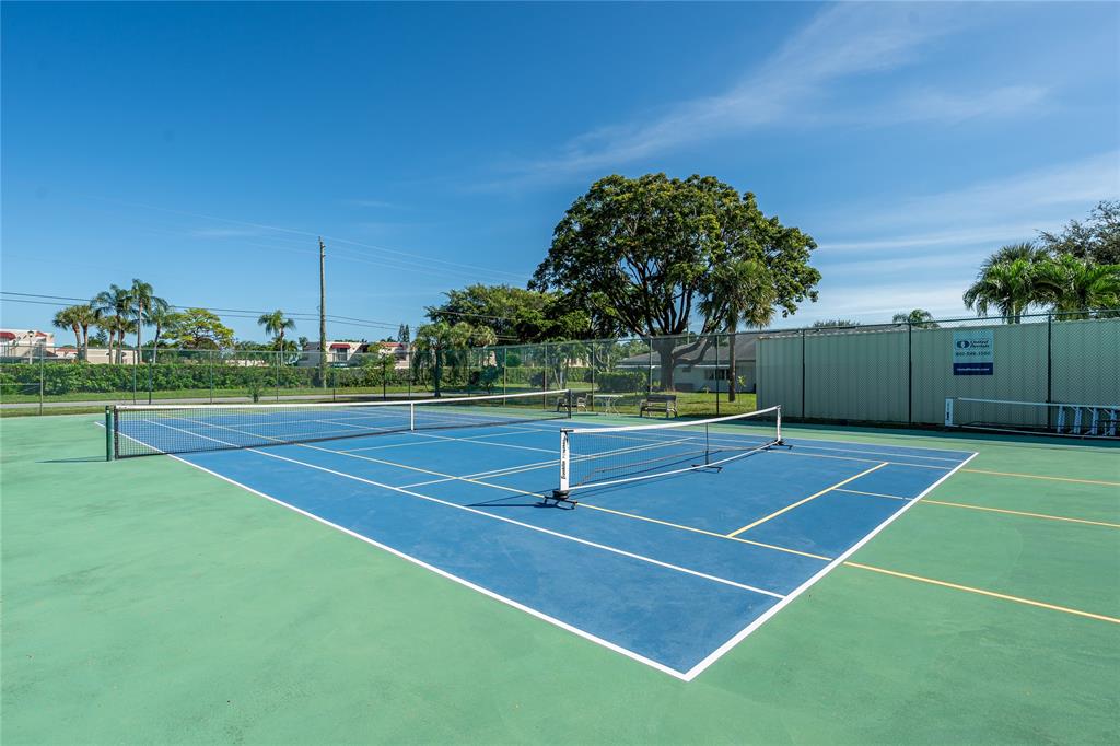 1130 Cir Terrace West, Unit D Delray Beach, FL 33445 - Photo 32 of 39 a view of tennis court