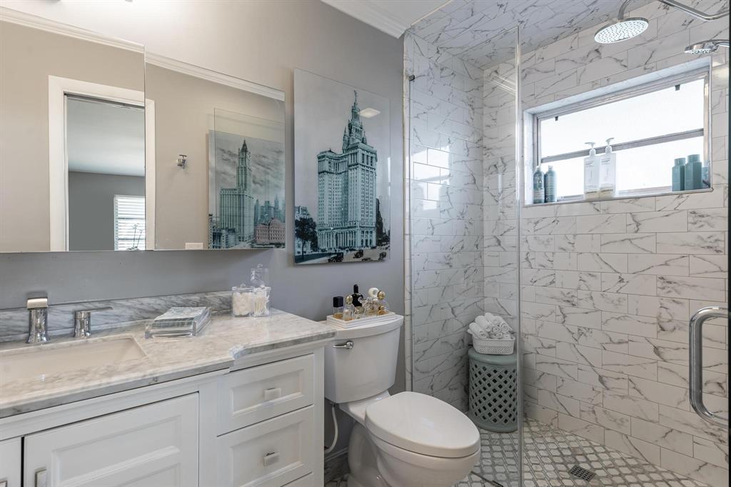1130 Cir Terrace West, Unit D Delray Beach, FL 33445 - Photo 9 of 39 a bathroom with a granite countertop toilet sink and mirror