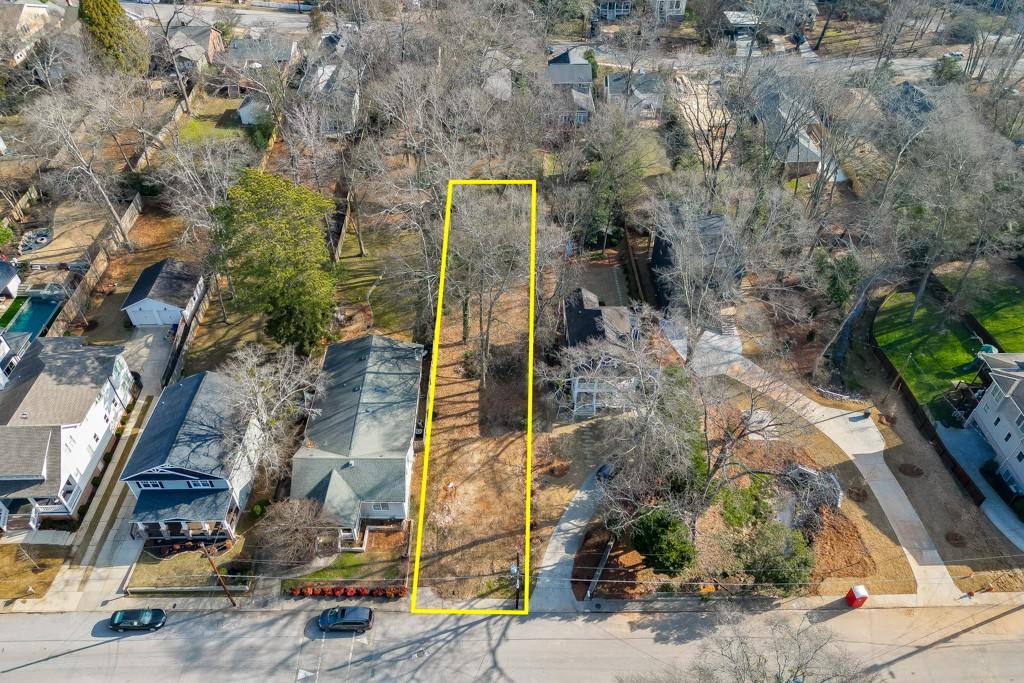 a aerial view of a house with a yard