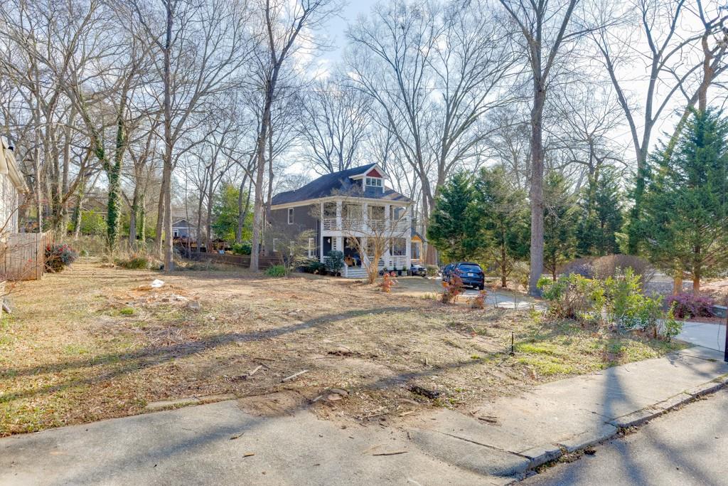 184 Olympic Place Decatur, GA 30030 - Photo 4 of 8 a view of a house with a yard covered in snow