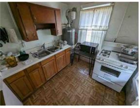 2835 Thomas Street Columbus, GA 31906 - Photo 14 of 19 a kitchen with sink refrigerator and stove