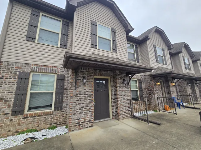 a front view of a house with garage