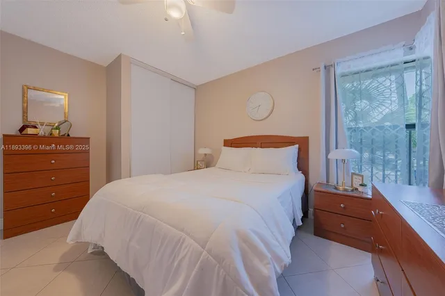 a bedroom with a bed and a mirror