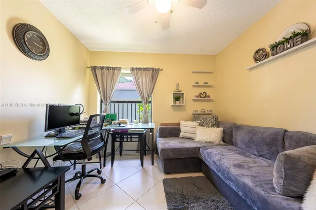 a view of a livingroom with furniture and a flat screen tv