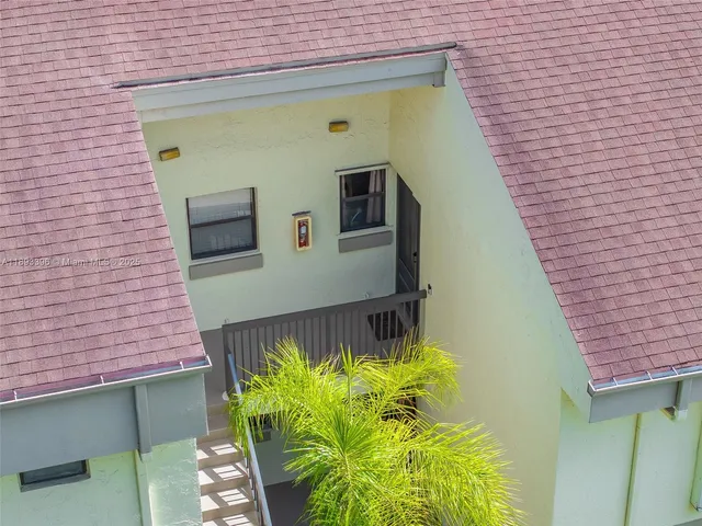 a building with trees in front of it