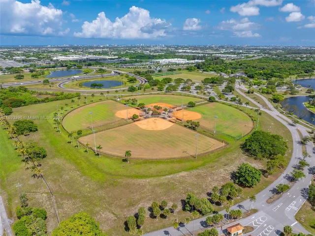 an aerial view of a houses with a lake view