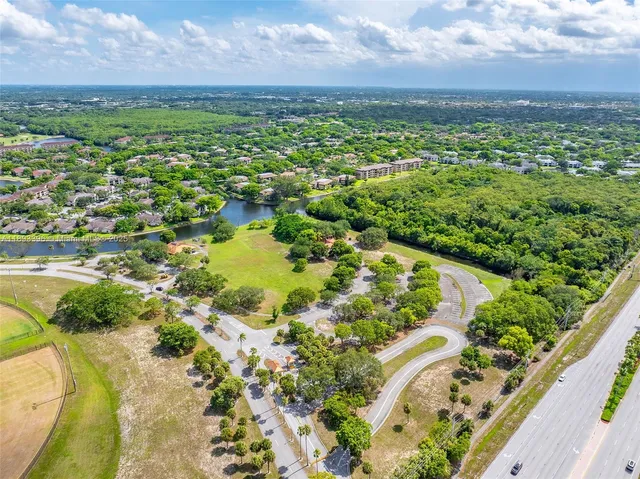 an aerial view of house with yard