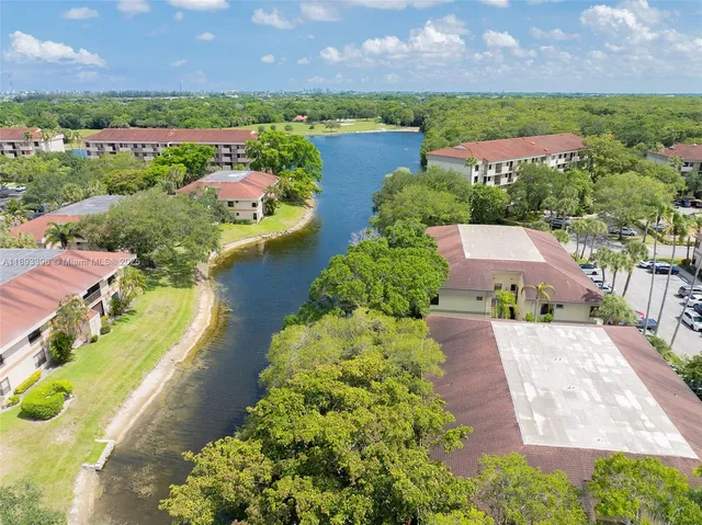 an aerial view of residential houses with lake view