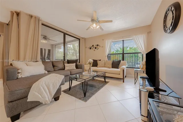 a hotel room with large window and a flat screen tv