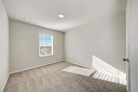 a bathroom with a glass shower door and a bathtub