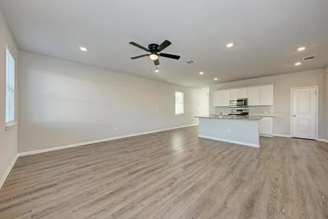 a view of a kitchen with a sink and a stove top oven