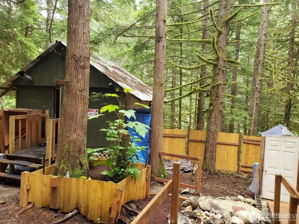 a backyard of a house with outdoor seating