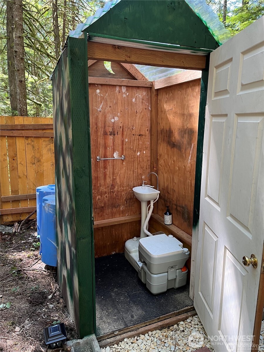64308 Cascade River Road, Unit 1147 Marblemount, WA 98267 - Photo 4 of 8 a view of a porch with a door and a yard