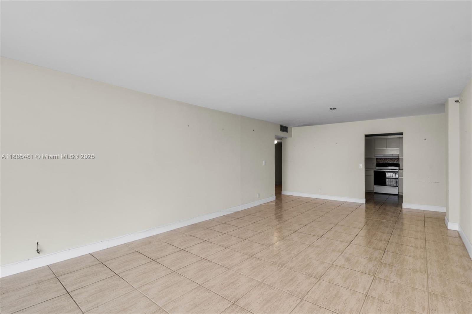8877 Collins Avenue, Unit 303 Surfside, FL 33154 - Photo 12 of 25 a view of an empty room with closet
