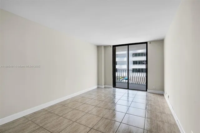 a view of an empty room and window