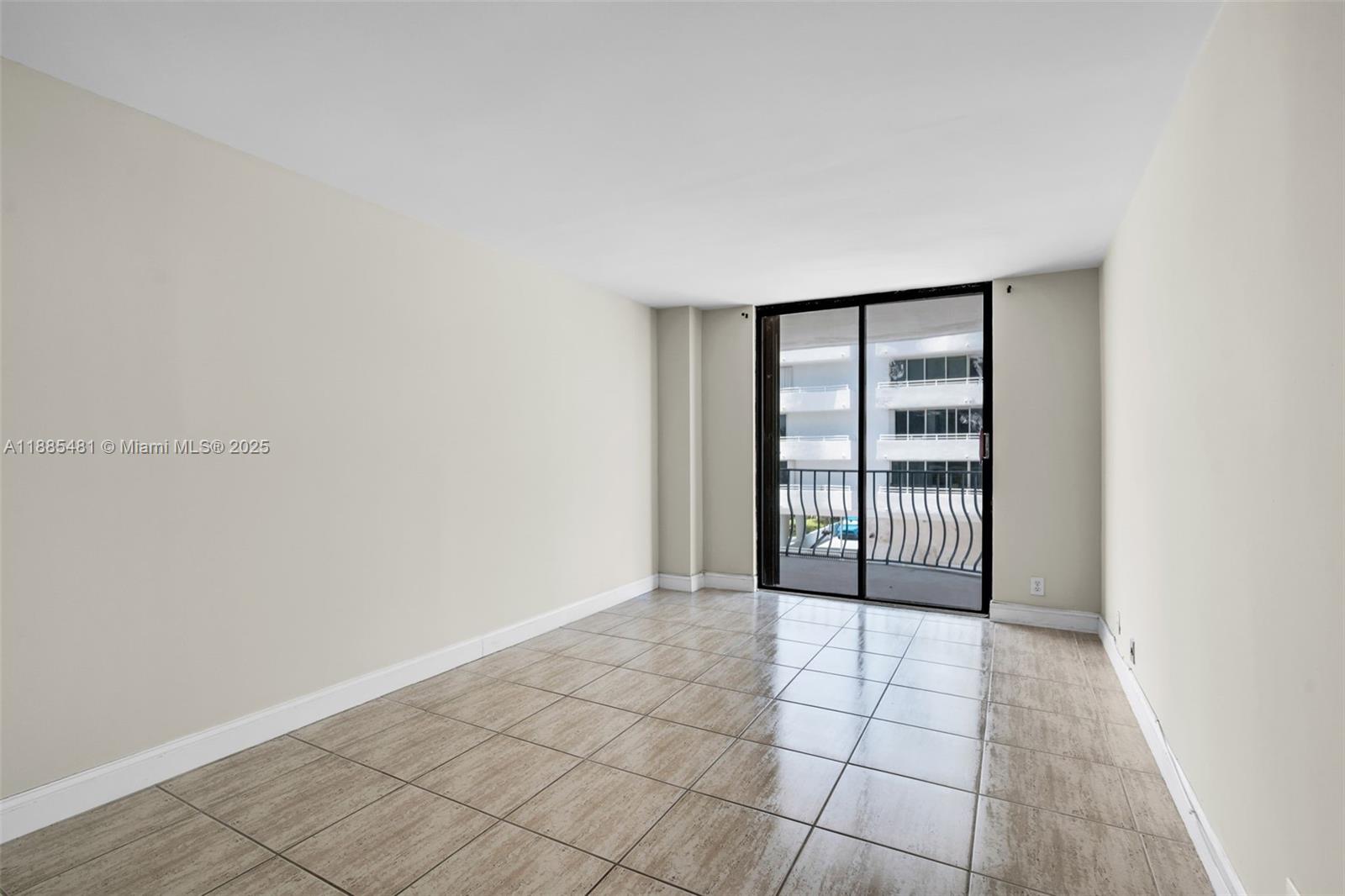 8877 Collins Avenue, Unit 303 Surfside, FL 33154 - Photo 18 of 25 a view of an empty room and window