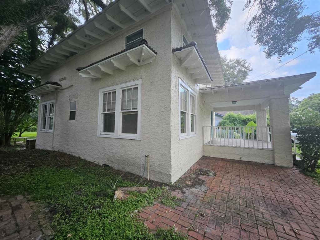 6404 Matchett Road Orlando, FL 32809 - Photo 16 of 20 a view of backyard with plants and large tree