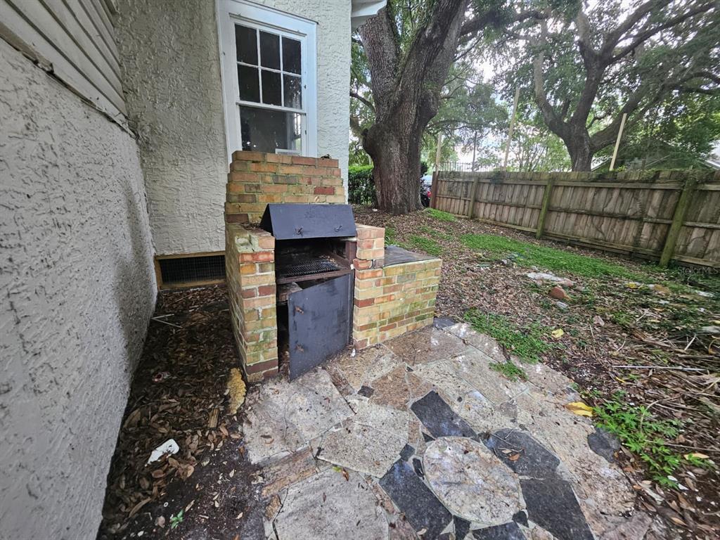 6404 Matchett Road Orlando, FL 32809 - Photo 20 of 20 a backyard of a house with wooden fence