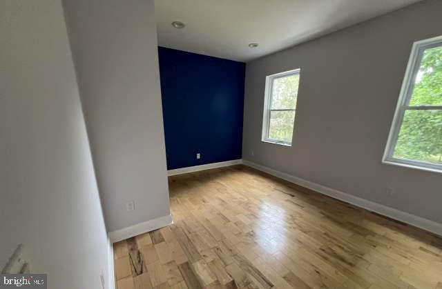 439 Erial Road Sicklerville, NJ 08081 - Photo 13 of 20 an empty room with wooden floor and windows