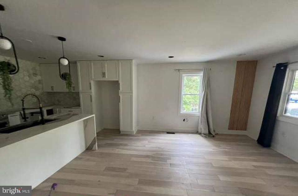 439 Erial Road Sicklerville, NJ 08081 - Photo 4 of 20 a view of a kitchen with a sink and refrigerator