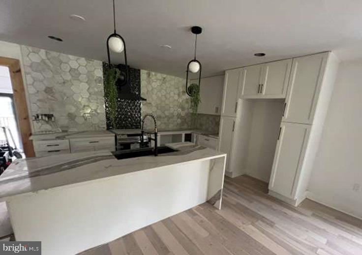 439 Erial Road Sicklerville, NJ 08081 - Photo 5 of 20 a large kitchen with stainless steel appliances a large counter top space wooden floor and a sink